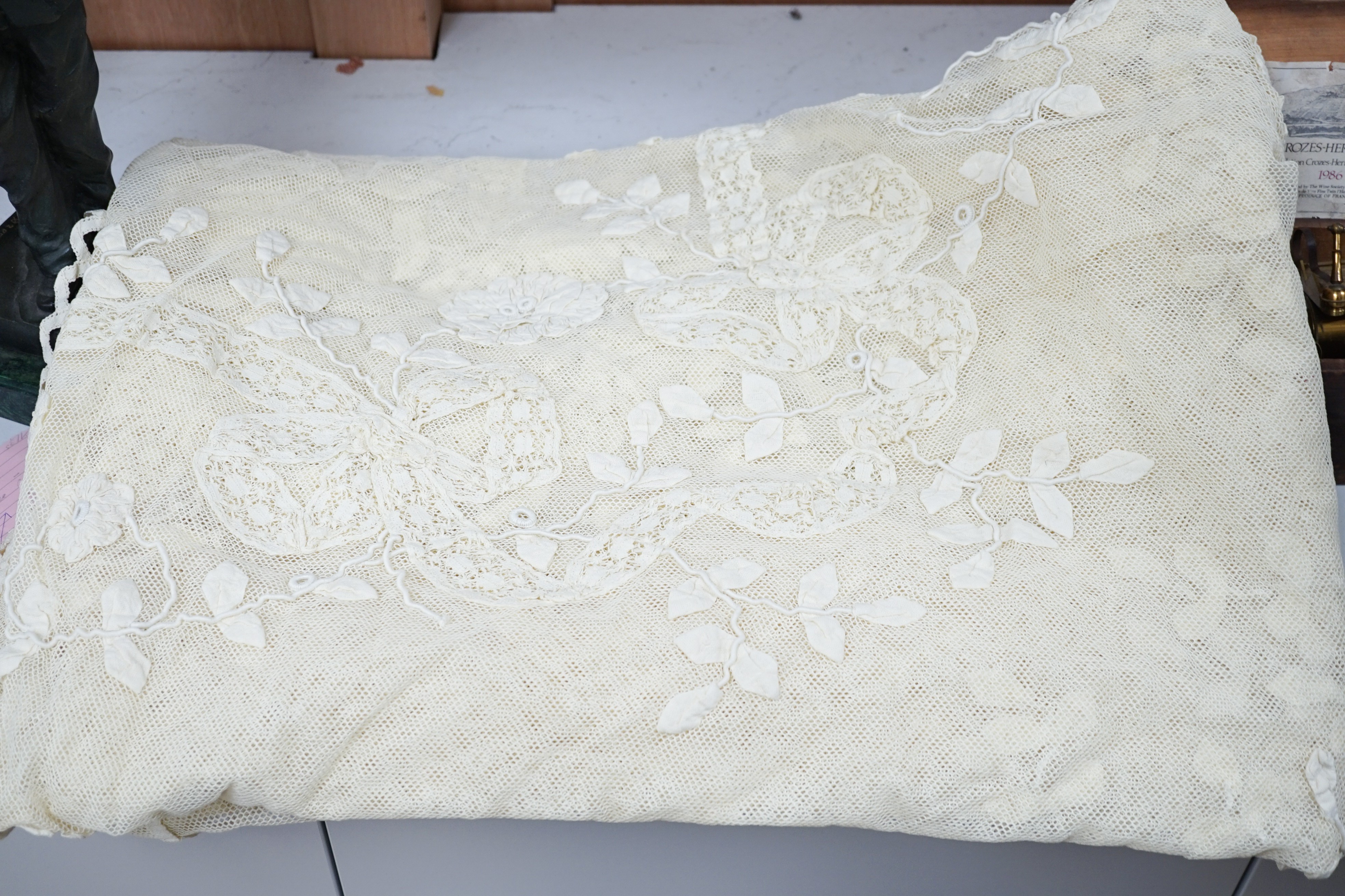 A cream tape vale on net bed cover, approximately 264 x 210cm